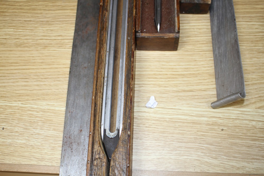 Three wooden cased technical draughtsman tools, stamped for the owner FJ Pearl, largest 77cm